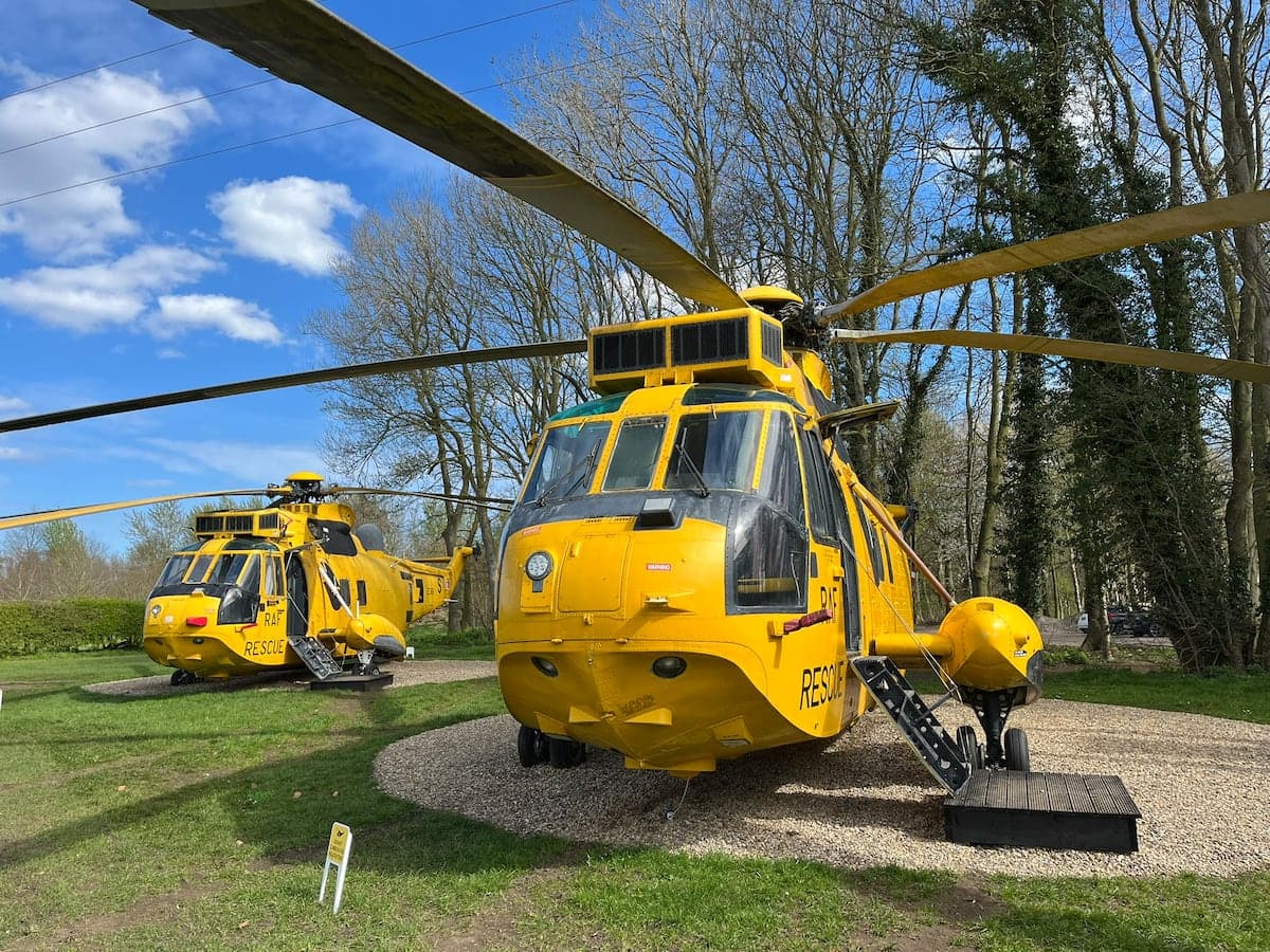 Two converted yellow RAF Sea King helicopter glamping pods at North Yorkshire Water Park